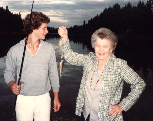 Grandson Gregg admiring the fish Clara May caught, around 1981.